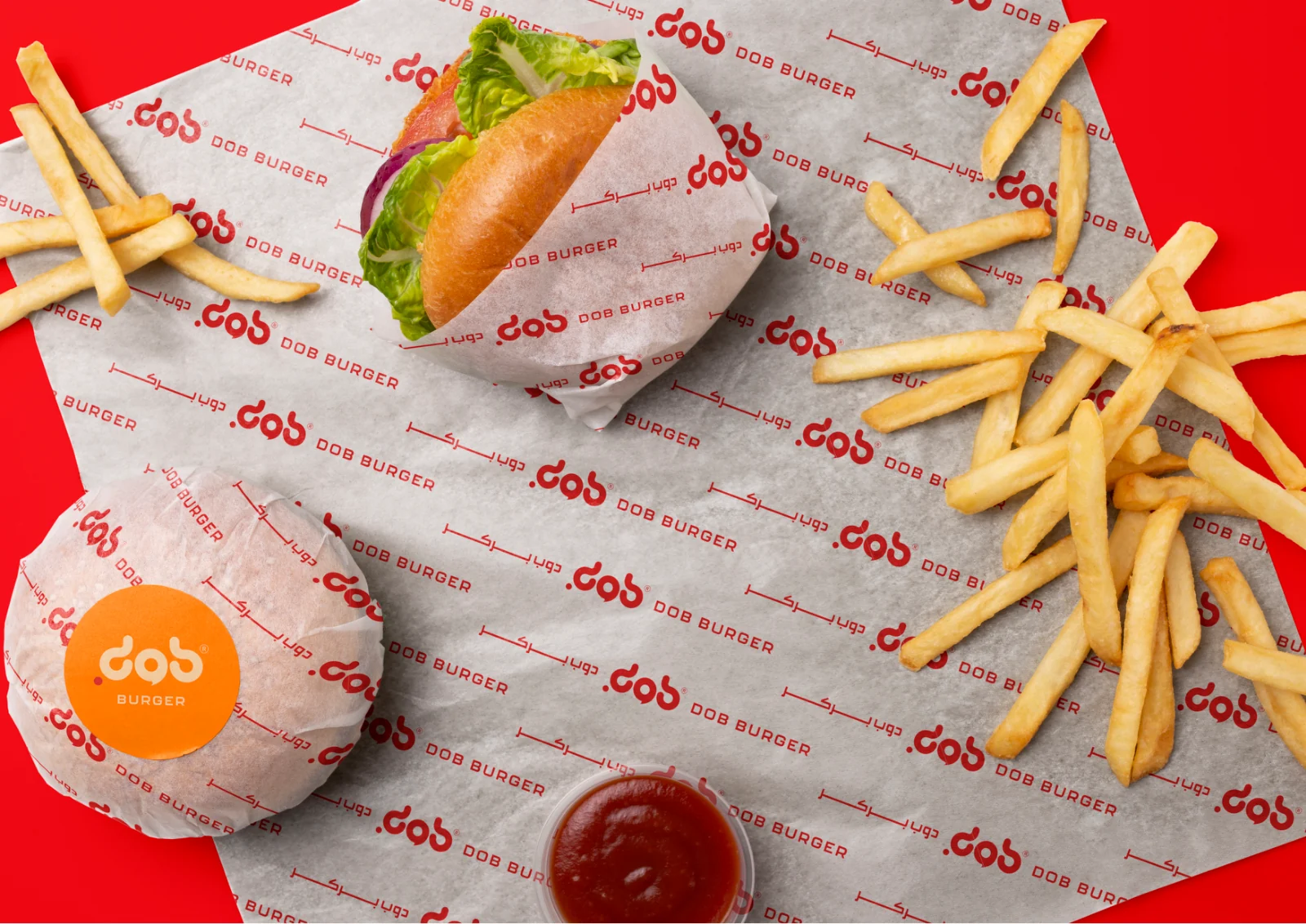 DOB Burger burger wrap and fries on branded paper